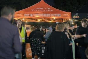 Vibrant Taranaki Beer Festival with diverse craft beers and lively crowd enjoying local brews.