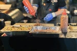 Vegan burger being prepared at Taranaki Beer Festival, showcasing food vendors and craft beer experiences in New Zealand.