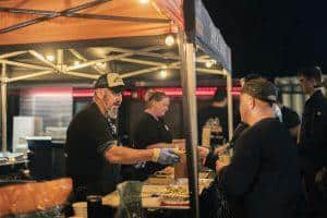 Freshly poured craft beer at Taranaki Beer Festival, lively night event showcasing local brews and beer tasting.