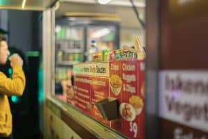 Vibrant beer festival scene with craft beers and food stalls at Taranaki Beer Festival, showcasing local brews and lively atmosphere.