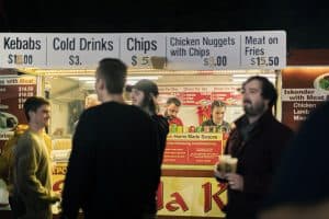 Fresh beer and food vendors at the Taranaki Beer Festival, showcasing local brews and delicious snacks for visitors.