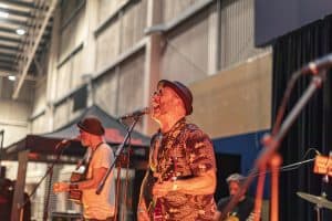 Vibrant live music performance at the Taranaki Beer Festival in New Zealand, showcasing local craft beers and lively entertainment.