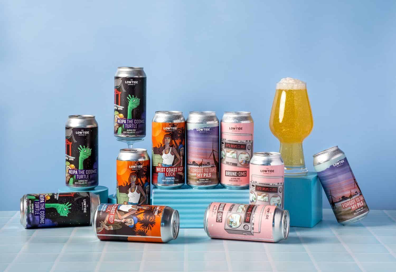 Colourful craft beer cans with vibrant labels and a glass of beer, celebrating Taranaki Beer Festival in New Zealand.