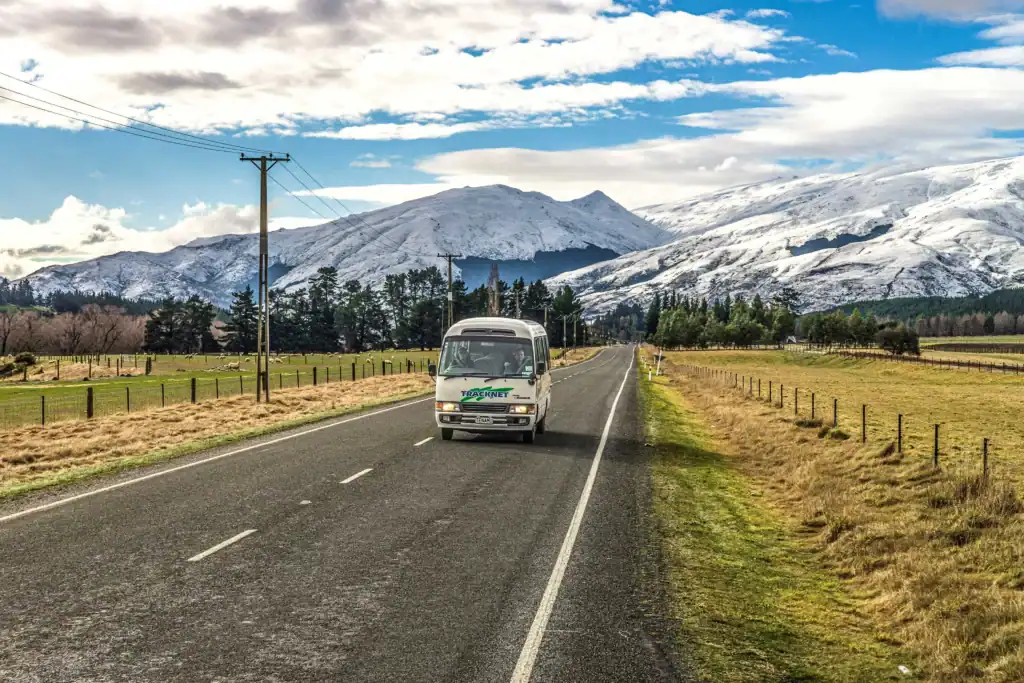 Tracknet bus in front of mountains on Milford Sound Road