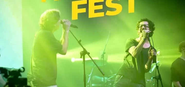 1. Band en concierto en Panza Fest, evento musical con artistas en vivo, iluminación espectacular y ambiente festivo.