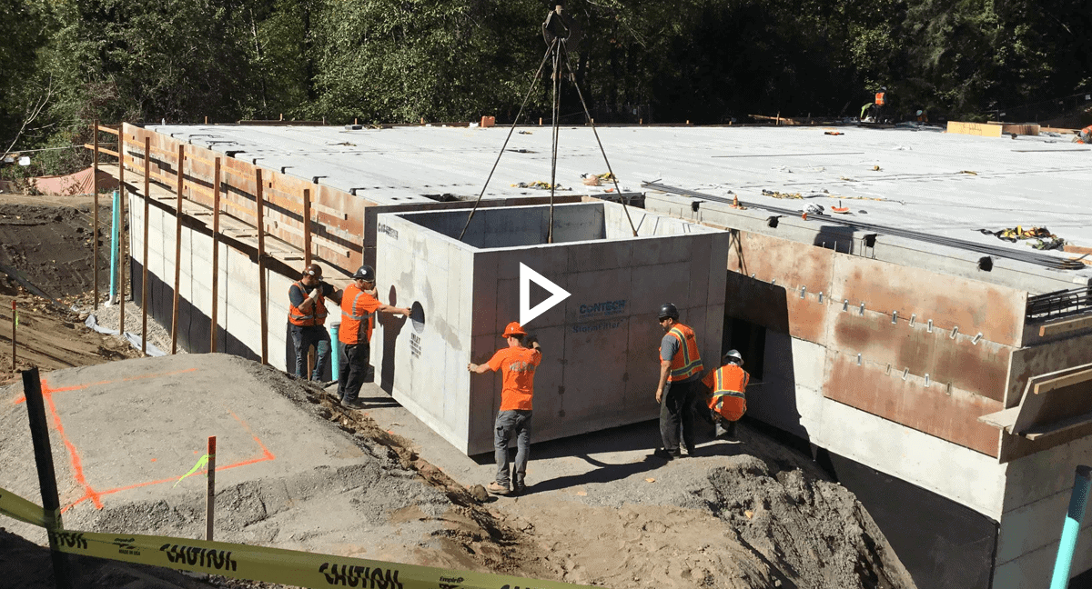 Team Nelson placing precast detention vault