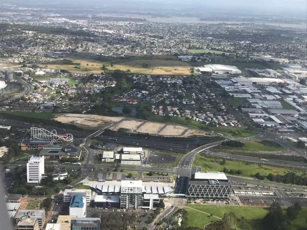 Aerial view of Te Tumu Kāinga development showcasing modern urban housing and green spaces in a vibrant community.
