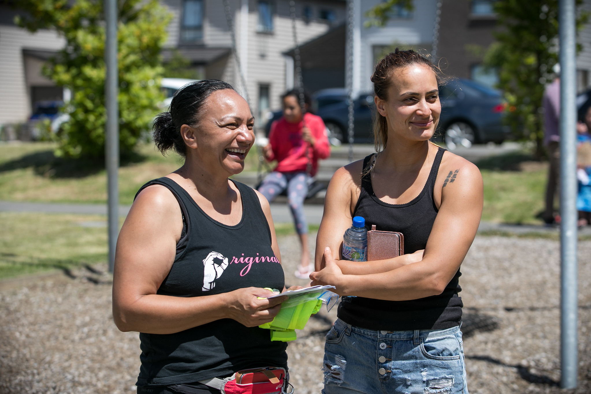Friendly community members enjoying outdoor activities at Te Tumu Kāinga in New Zealand.