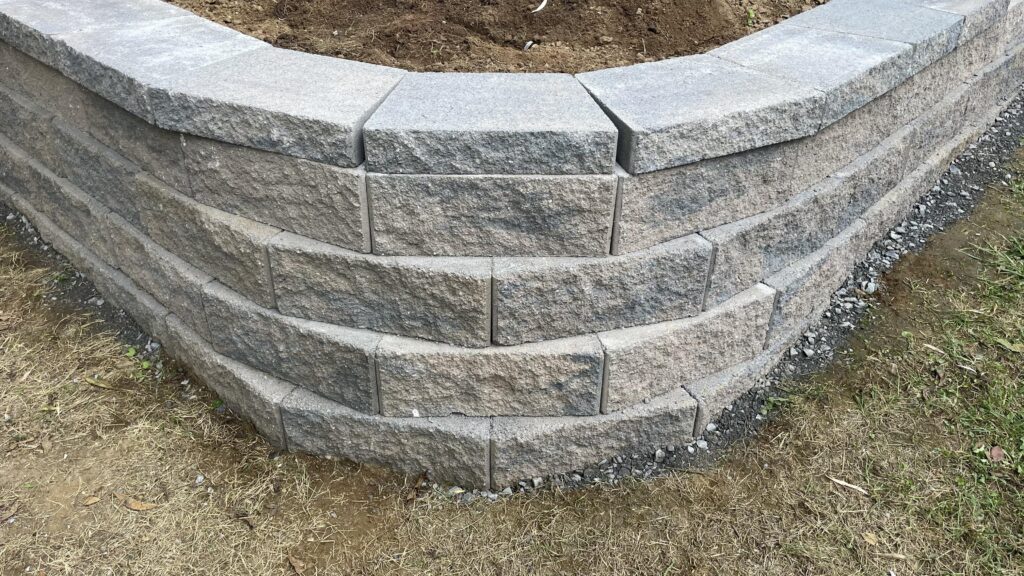 retaining wall with gaps between caps shows poor workmanship