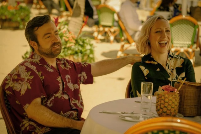 Phil (Derek Waters) and Maude (Anna Konkle) in Side Quest (Apple TV+)