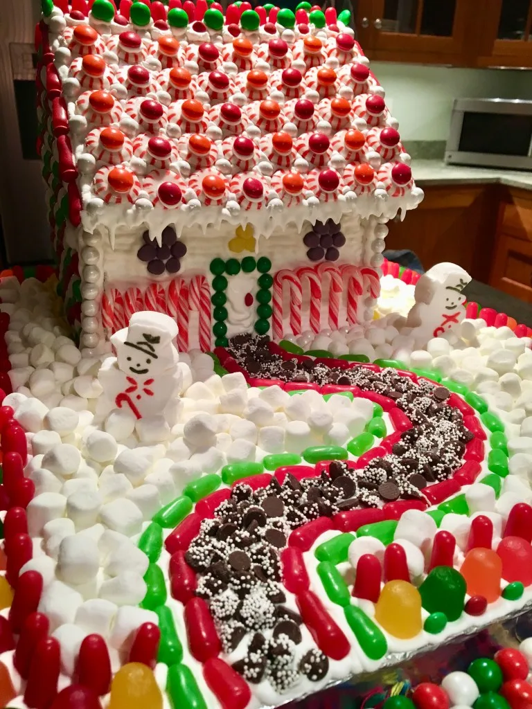 gingerbread house decorated with royal icing and candies