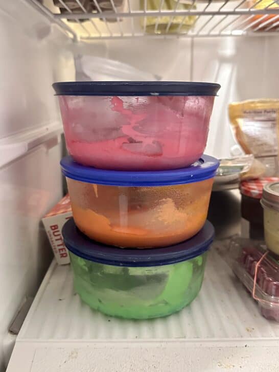 3 stacked glass pyrex bowls used for storing royal icing in the refrigerator