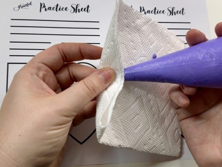 cleaning off tip of royal icing bag 