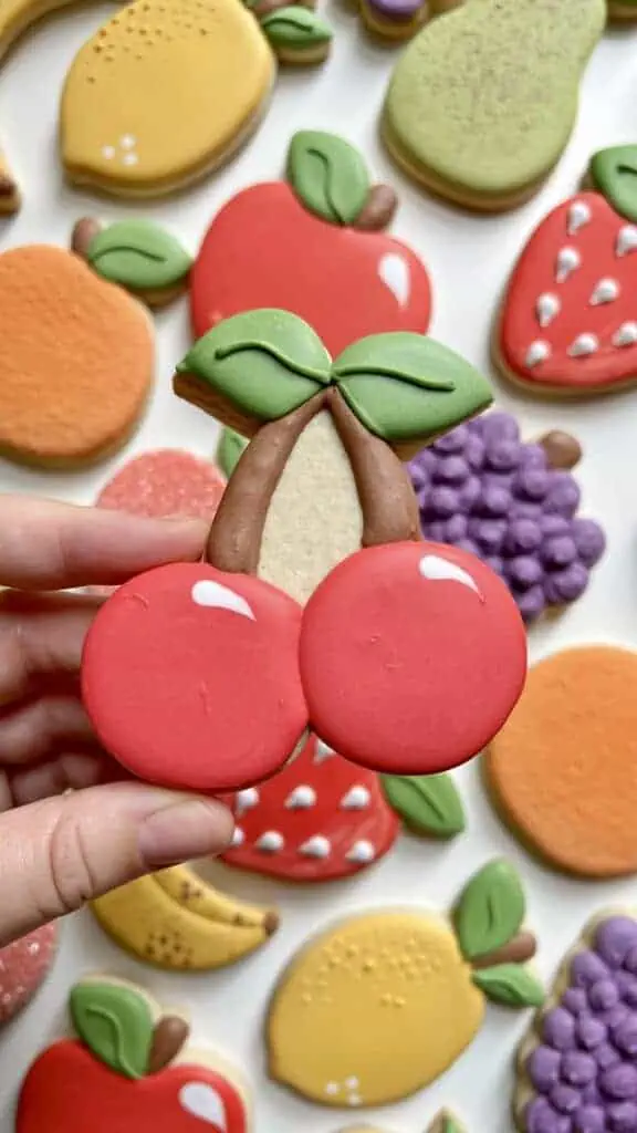 cherry cookie decorated with royal icing 