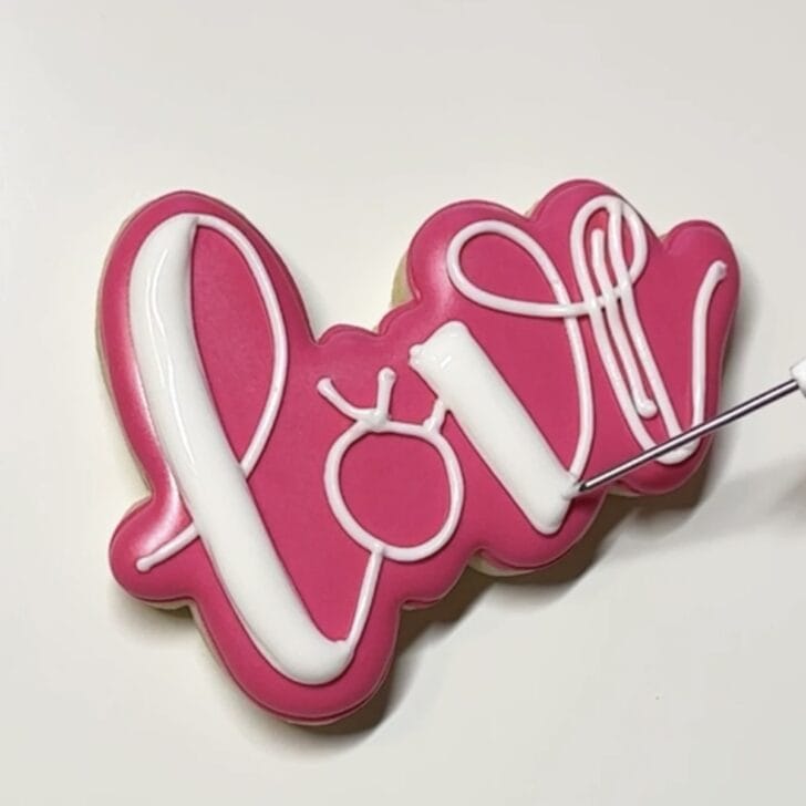 writing with royal icing saying LOVE 