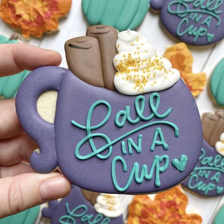 photo of writing with royal icing on a cookie: script saying THANKFUL