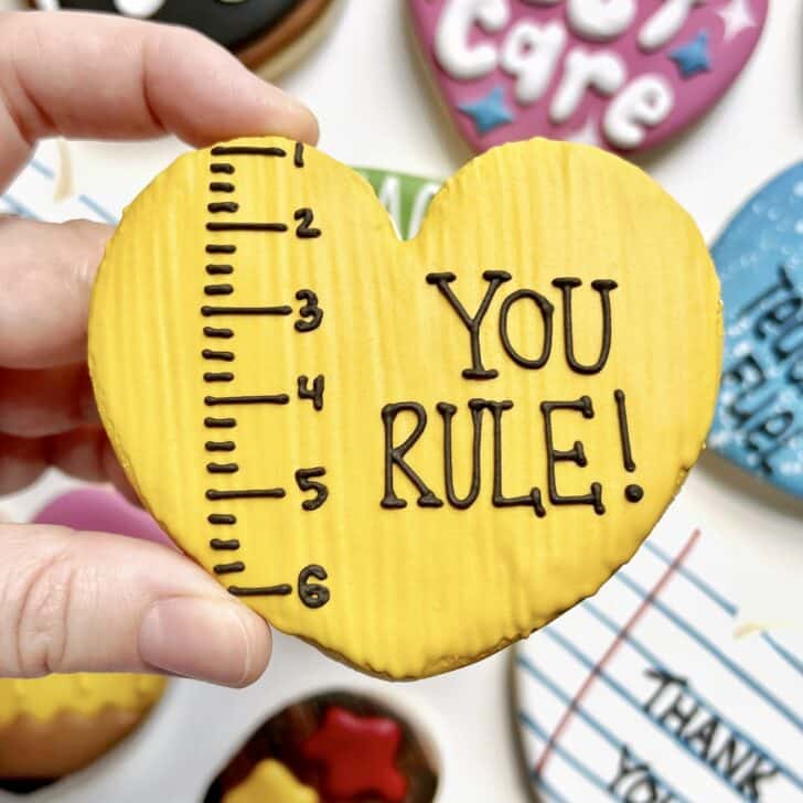 photo of freehanded writing with royal icing saying YOU RULE