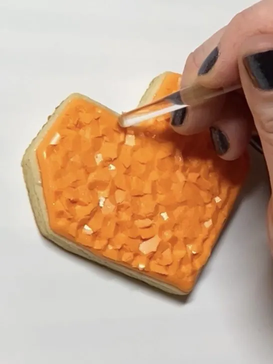 step 3 of decorating heart cookies with royal icing
