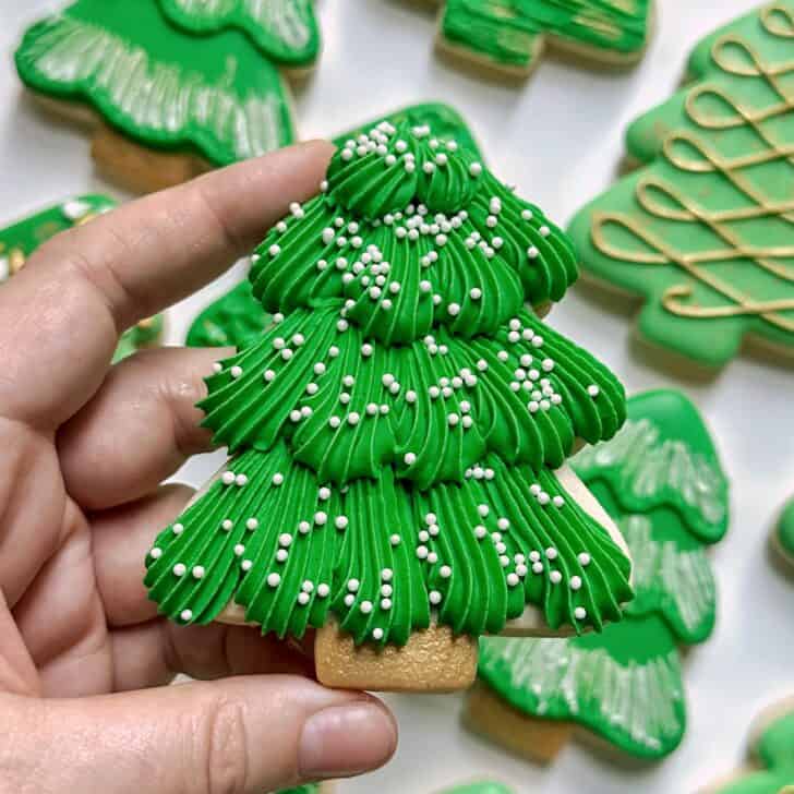 star tip piped christmas tree cookie with royal icing