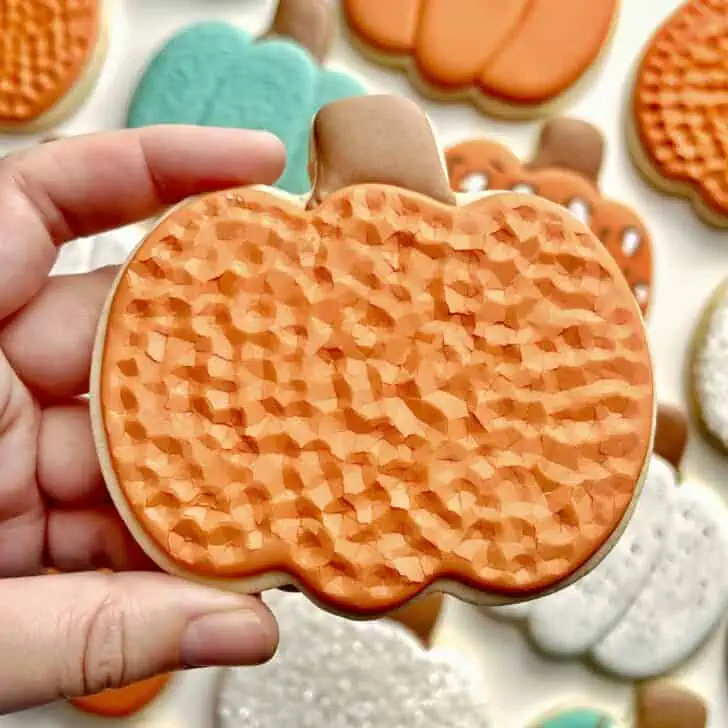 orange crackle Pumpkin Cookies with royal icing