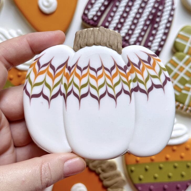 pumpkin cookies decorated with royal icing 