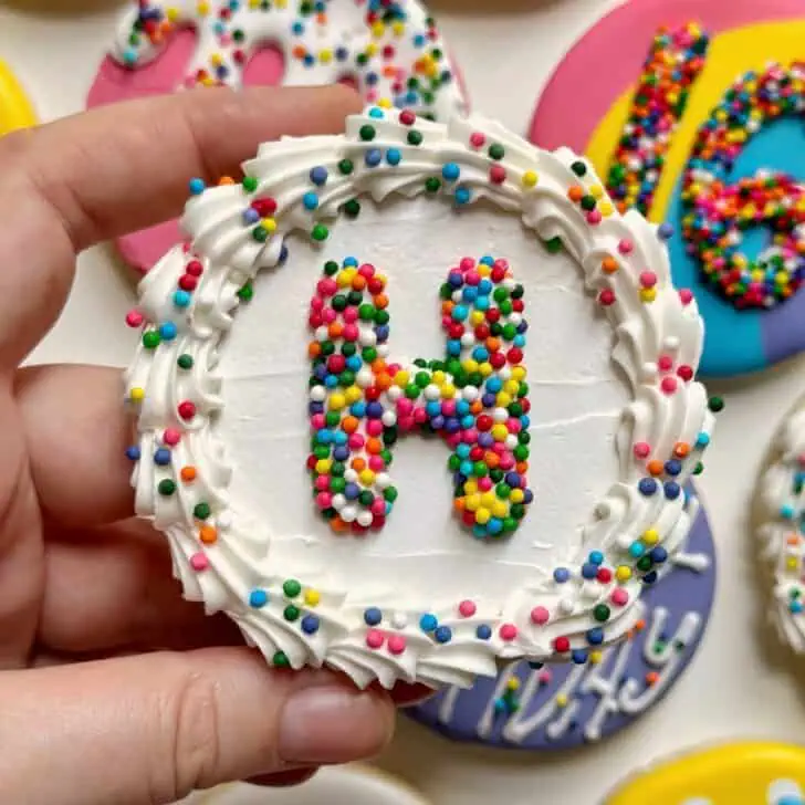 birthday cake cookies decorated with royal icing