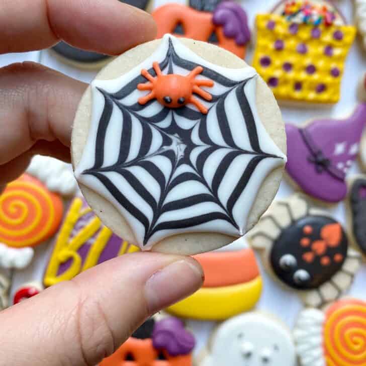 spider web cookie decorated with royal icing