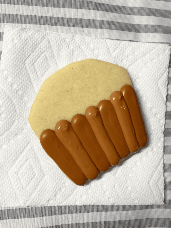 Step-by-step decorating instructions for how to decorate Apple basket cookies with royal icing