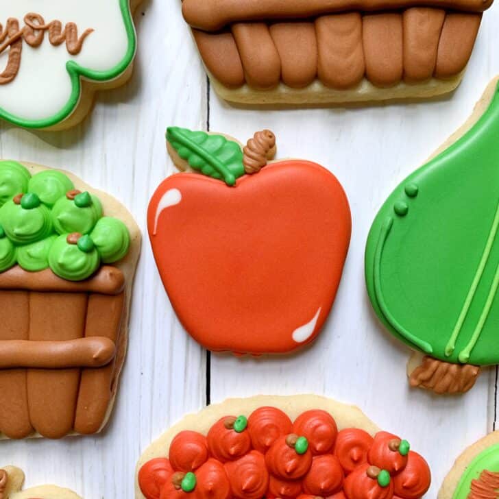 apple decorated cookies decorated with royal icing