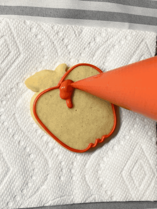 Step-by-step decorating instructions for how to decorate apple decorated cookies with releasing