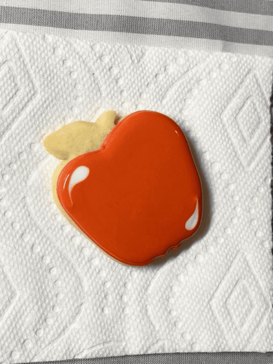 Step-by-step decorating instructions for how to decorate apple decorated cookies with releasing