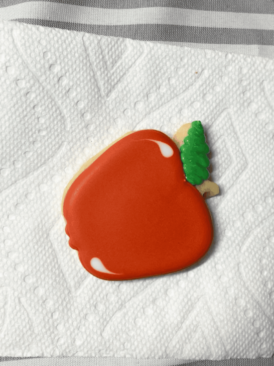 Step-by-step decorating instructions for how to decorate apple decorated cookies with releasing