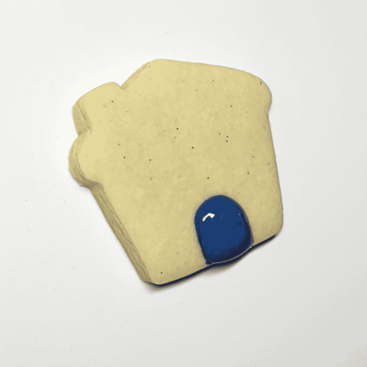 step by step decorating instructions for Mini Gingerbread House Cookies