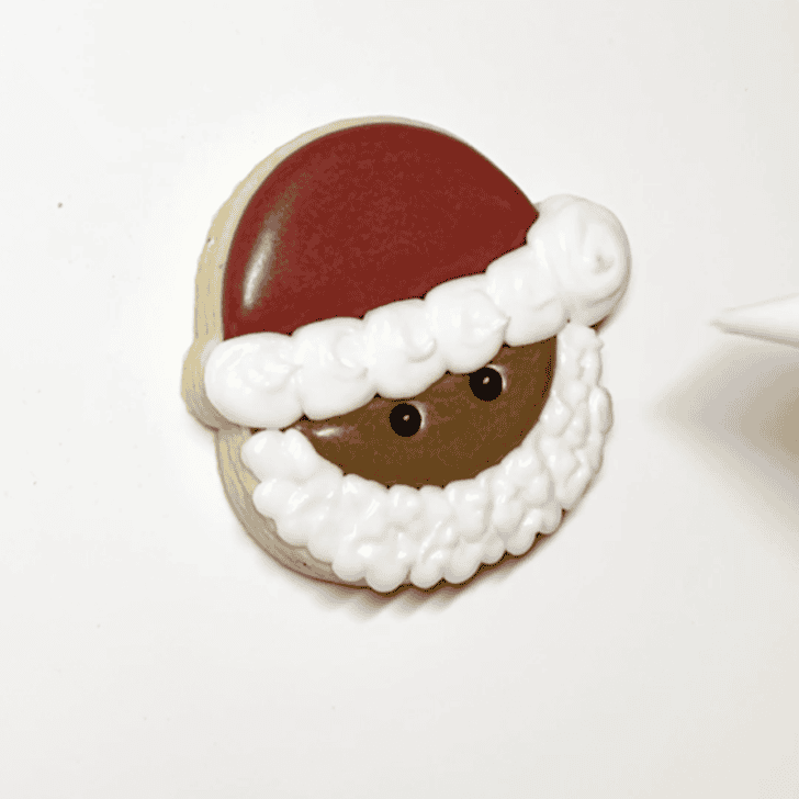 step 5 for decorating a santa cookie with royal icing