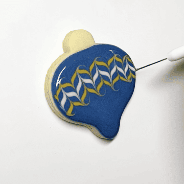 step by step directions on how to decorate a simple ornament cookie with royal icing