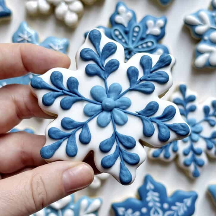 white snowflake cookie decorated with royal icing 