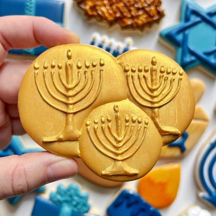 gelt cookie decorated with royal icing