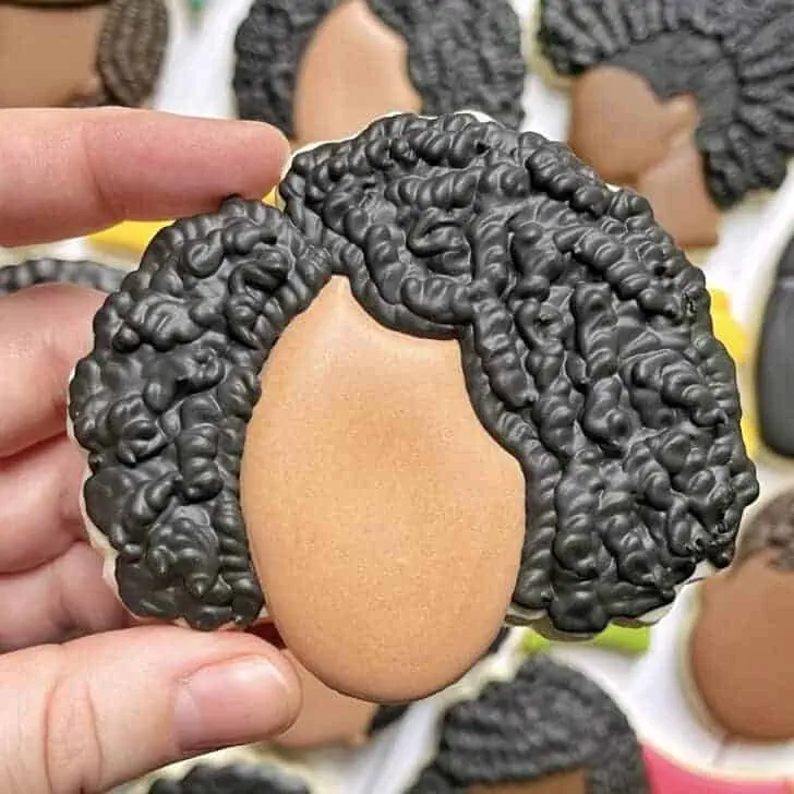 Black History Month Cookies of curly bob hairstyle decorated with royal icing