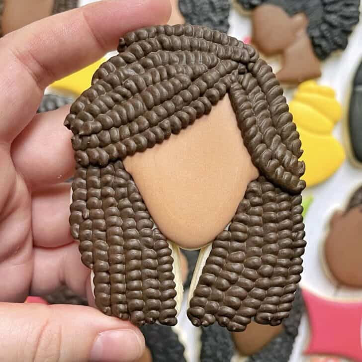Black History Month Cookies of locs hairstyle decorated with royal icing