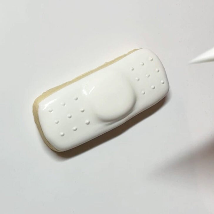 how to decorate band aid cookies with royal icing