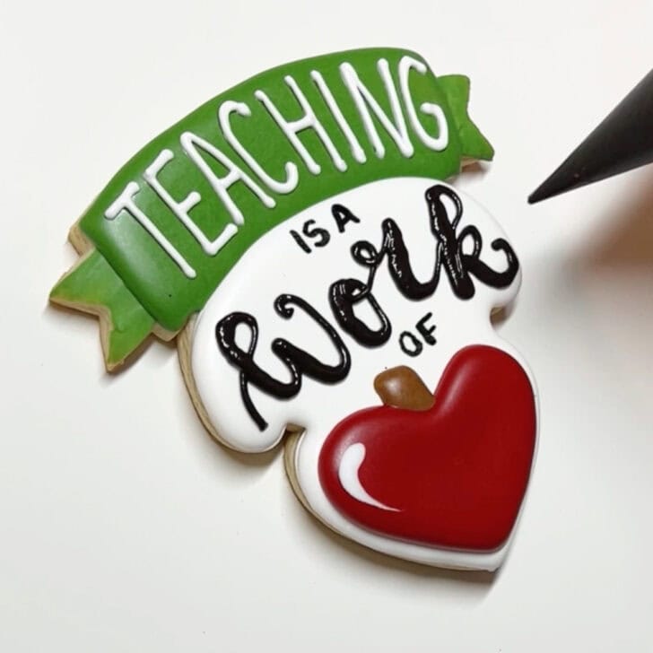 how to decorate teaching is a work of heart cookies with royal icing