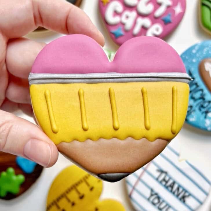 pencil cookies decorated with royal icing