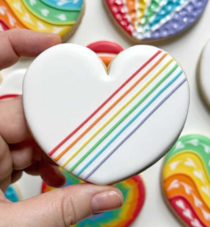 rainbow heart cookie decorated with royal icing
