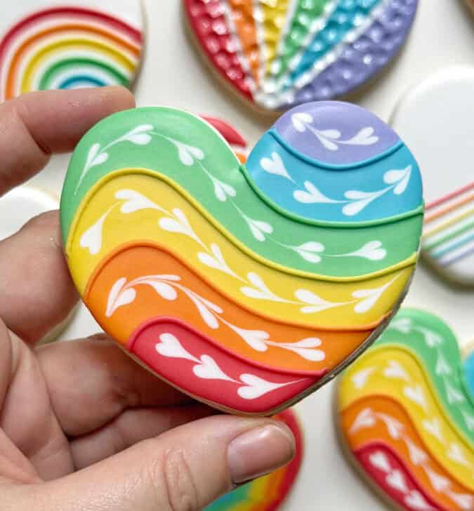 rainbow heart cookie decorated with royal icing