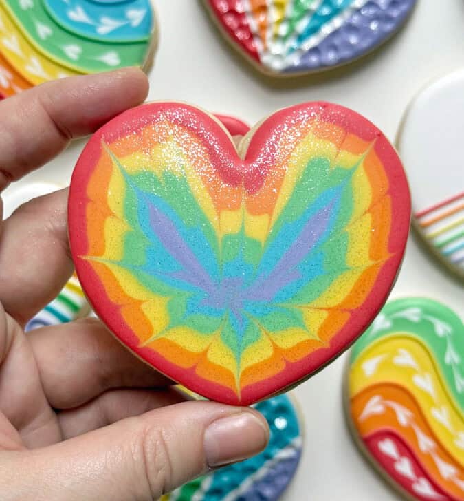 rainbow heart cookie decorated with royal icing