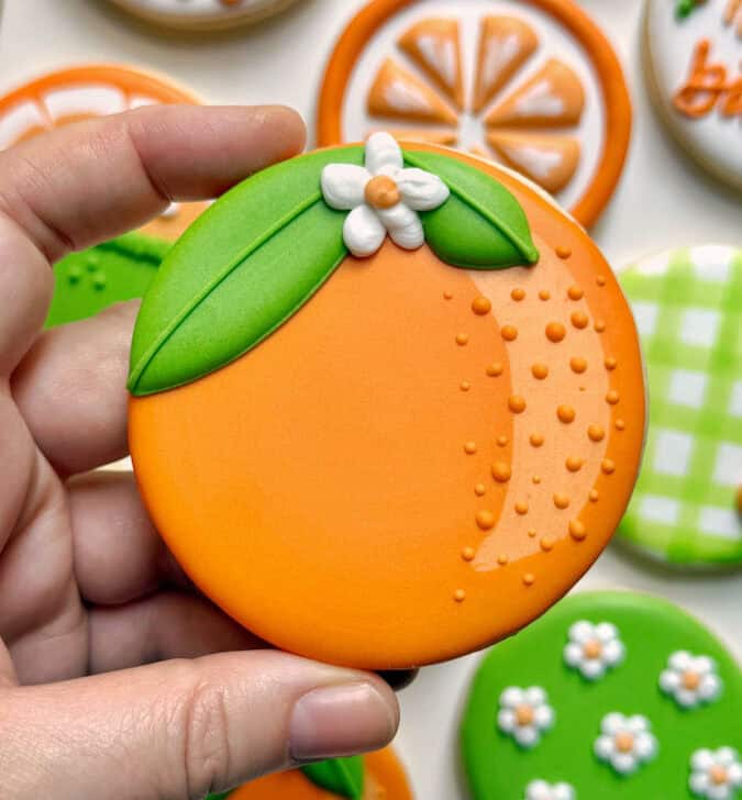 orange cookie decorate with royal icing