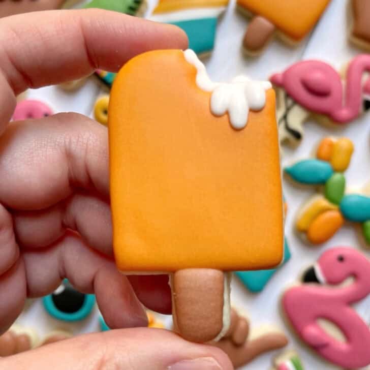 Orange creamsicle cookies decorated with royal icing