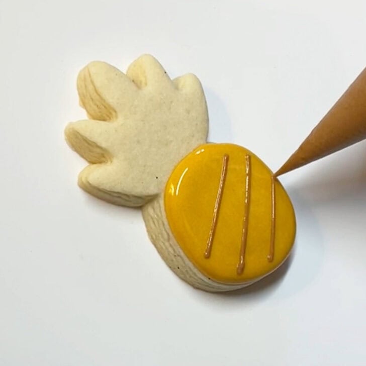 Step-by-step instructions for decorated pineapple cookies with royal icing