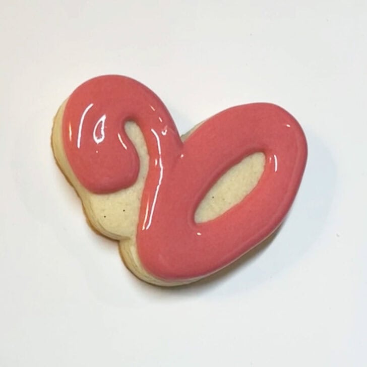Step-by-step instructions for how to decorate flamingo pool float cookies with royal icing