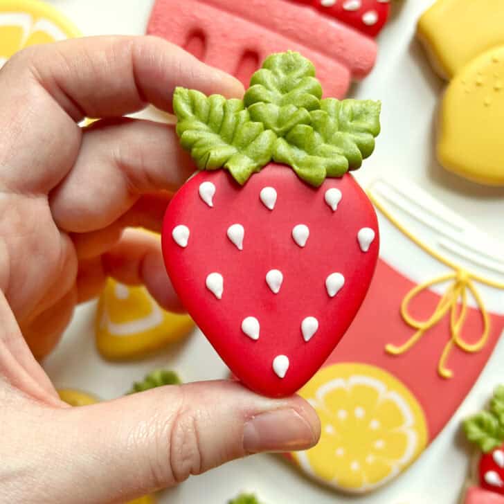 example of royal icing leaves piped with a tipless piping bag